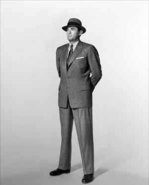 A working man from the 1950s, dressed in a suit to go to work.