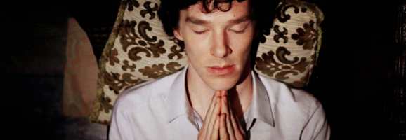 Sherlock Holmes, here portrayed by Benedict Cumberbatch, in quiet contemplation.