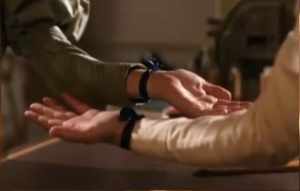 Pearl and Enid pledging a vow of friendship, with matching ribbon-bracelets, in Lark Rise to Candleford's episode eight of season three. 