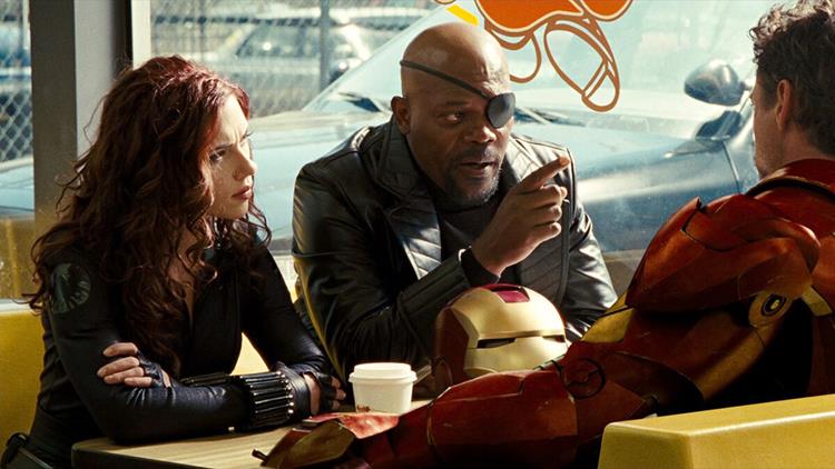 Black Widow and Nick Fury talking to Tony Stark