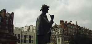 A statue dedicated to Holmes, eternally donning his deerstalker cap and pipe 
