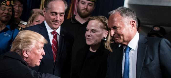 Perlmutter shaking hands with Trump