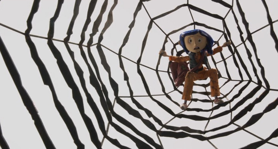 Coraline stuck in the center of the Other Mother's web